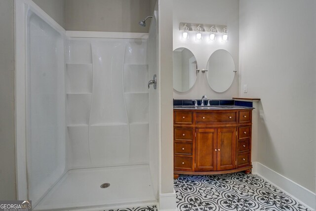31 N Broad St, Porterdale, GA 30014 - full bathroom with a shower, vanity, baseboards, and tile patterned flooring