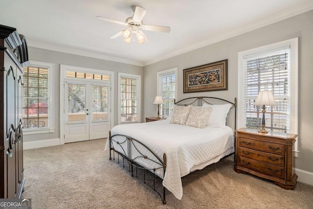 carpeted bedroom featuring ceiling fan, crown molding, and french doors