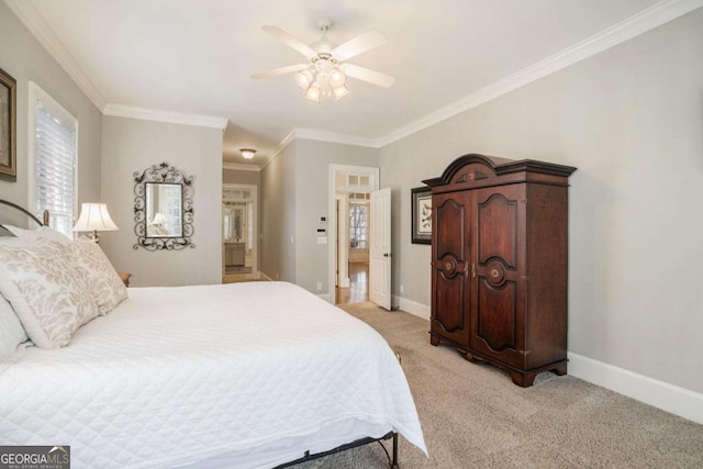 carpeted bedroom featuring ceiling fan and ornamental molding