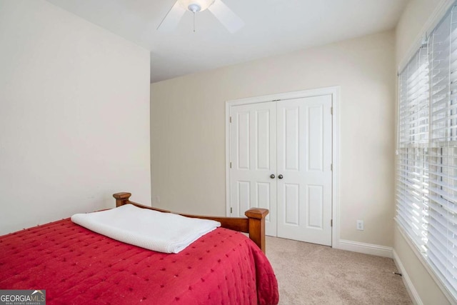 bedroom featuring carpet, a closet, and ceiling fan