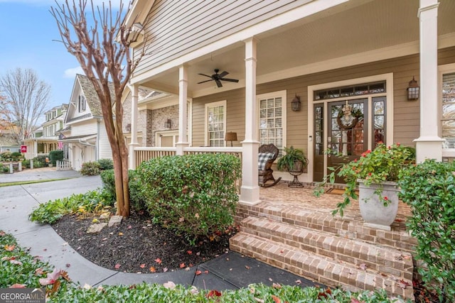 property entrance featuring ceiling fan and covered porch