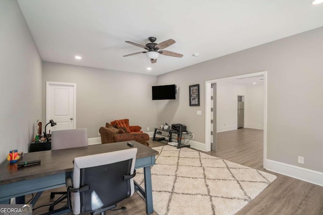 office area featuring ceiling fan and light wood-type flooring