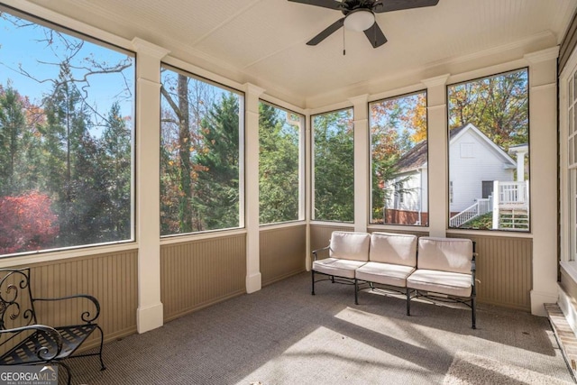 sunroom / solarium with a wealth of natural light and ceiling fan