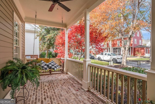 view of patio featuring ceiling fan and a porch