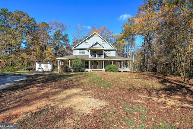 view of front of property with a porch and an outdoor structure