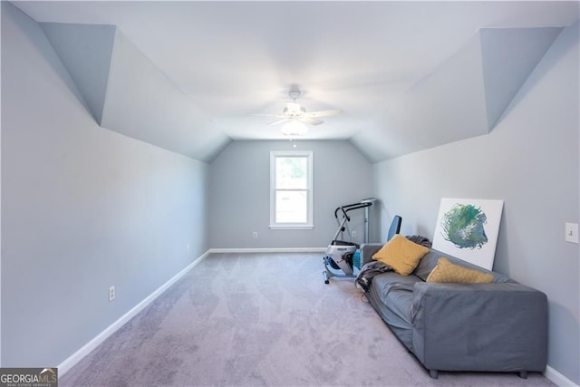 sitting room with light carpet, vaulted ceiling, and ceiling fan