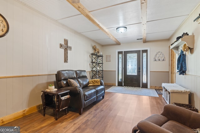 entryway with hardwood / wood-style flooring and wood walls