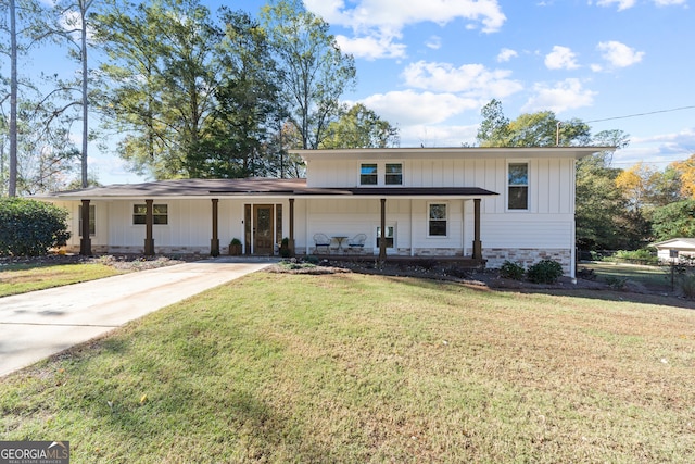 view of front of property with covered porch and a front yard