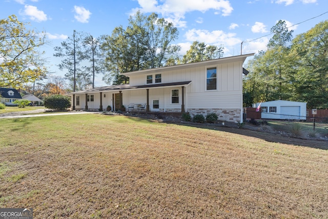 view of front facade featuring a porch and a front lawn