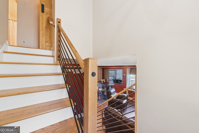 stairs with hardwood / wood-style flooring