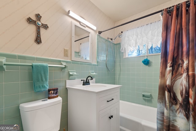 full bathroom featuring vanity, toilet, tile walls, and shower / bath combo with shower curtain