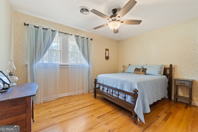 bedroom featuring hardwood / wood-style flooring and ceiling fan