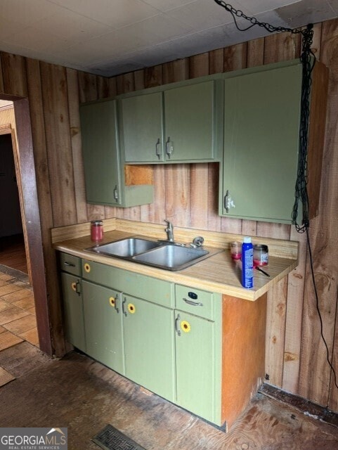 kitchen with green cabinets and sink