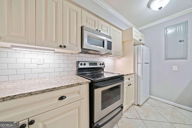 kitchen with backsplash, crown molding, light tile patterned floors, appliances with stainless steel finishes, and cream cabinetry