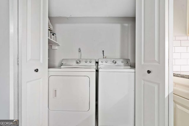 laundry area with washer and clothes dryer