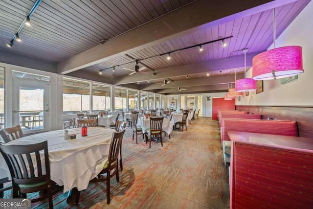 dining area featuring beam ceiling, ceiling fan, wood ceiling, and track lighting