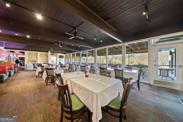 dining space with beamed ceiling, ceiling fan, wood ceiling, and rail lighting