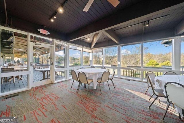 sunroom with ceiling fan, a healthy amount of sunlight, and rail lighting