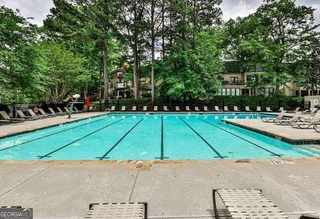 view of swimming pool with a patio area