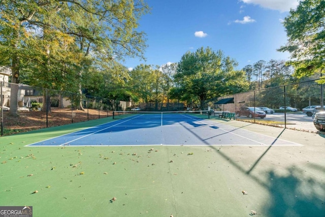 view of sport court with basketball hoop