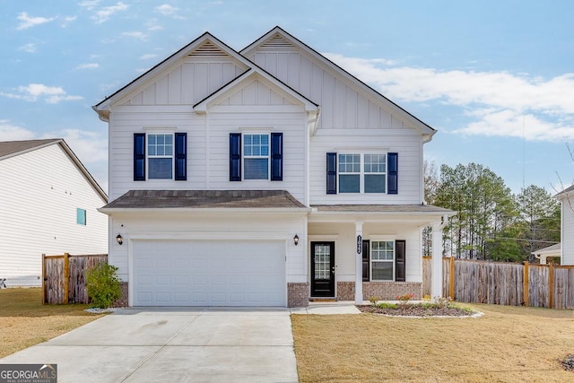 view of front of property with a garage and a front yard