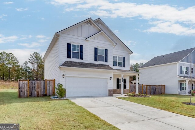 view of front of house with a garage and a front yard