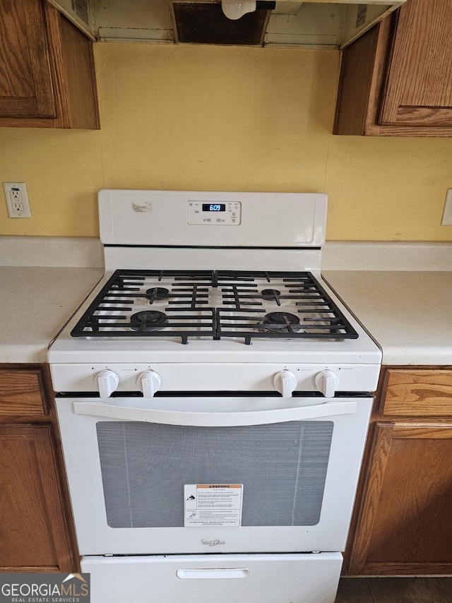 kitchen featuring white range with gas cooktop