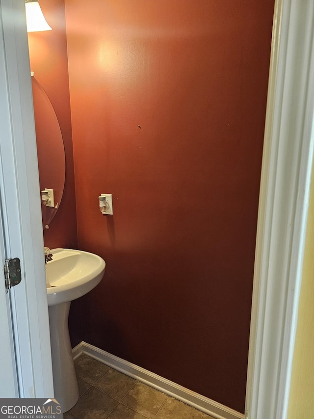 bathroom featuring tile patterned flooring and sink