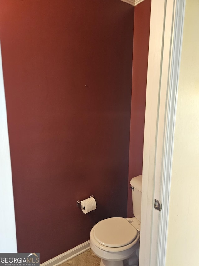 bathroom featuring tile patterned floors and toilet