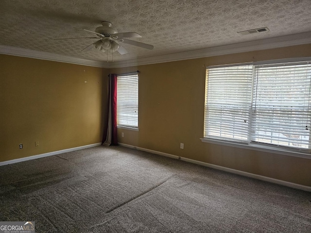 carpeted spare room with ceiling fan, crown molding, and a textured ceiling