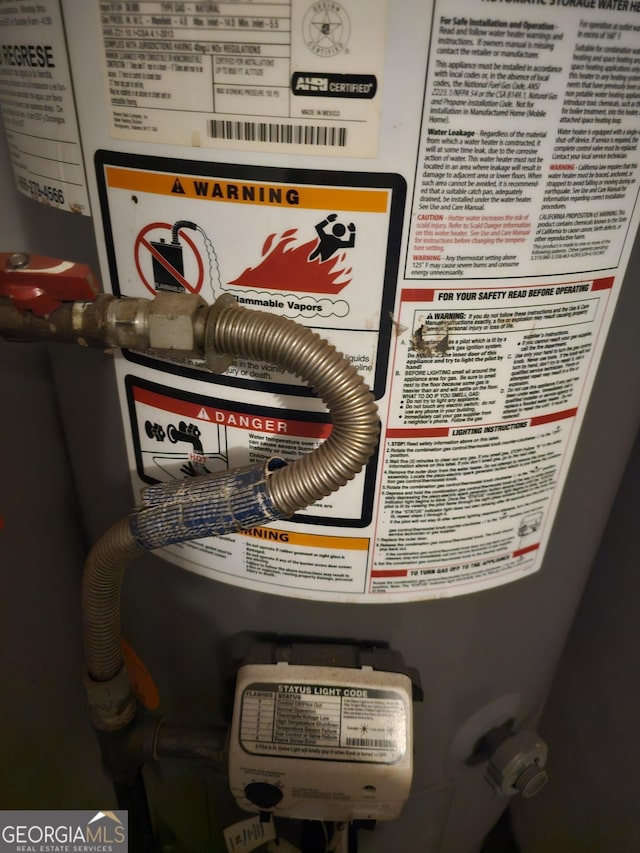 utility room featuring gas water heater