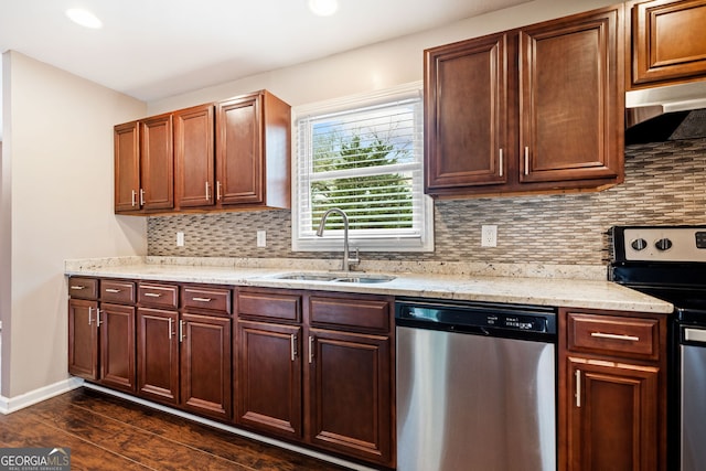 kitchen featuring decorative backsplash, dark hardwood / wood-style flooring, stainless steel appliances, and sink