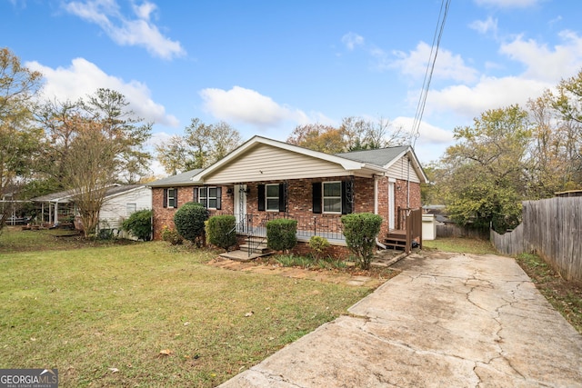 view of front of home featuring a front lawn and covered porch