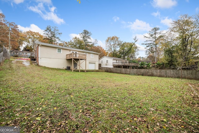 view of yard with a wooden deck