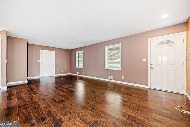 entrance foyer with dark hardwood / wood-style floors