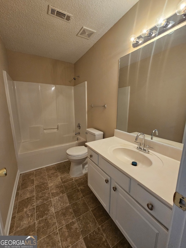 full bathroom featuring vanity, a textured ceiling, shower / bath combination, and toilet