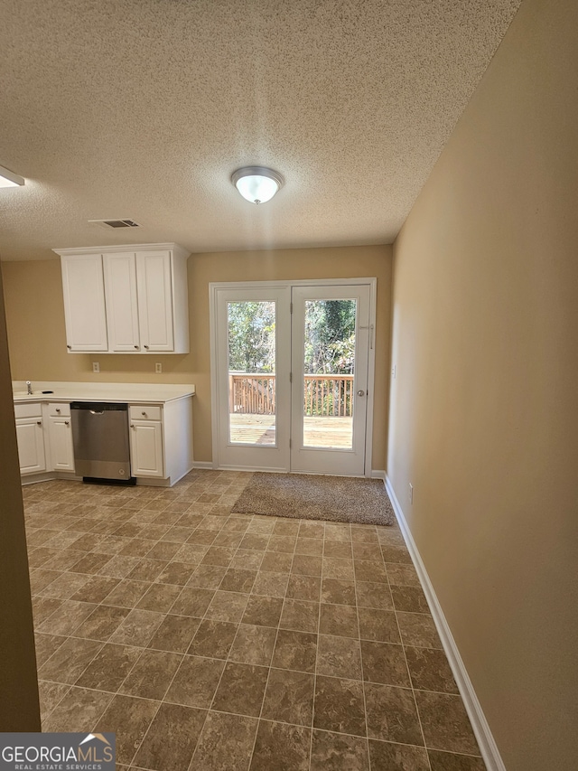 entryway with a textured ceiling