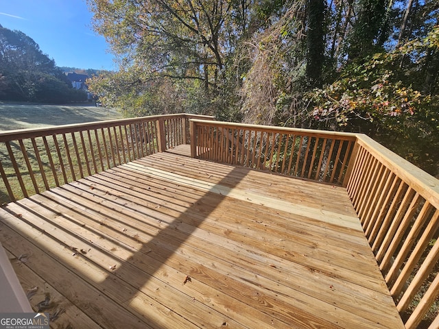 wooden deck with a water view