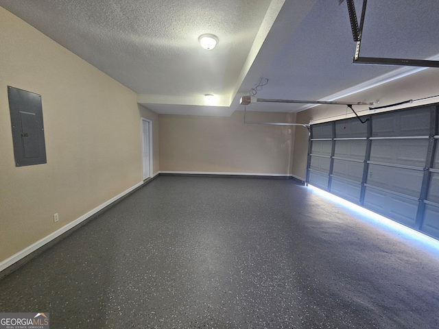 garage with electric panel and a garage door opener