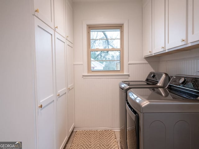 laundry area with cabinets and separate washer and dryer