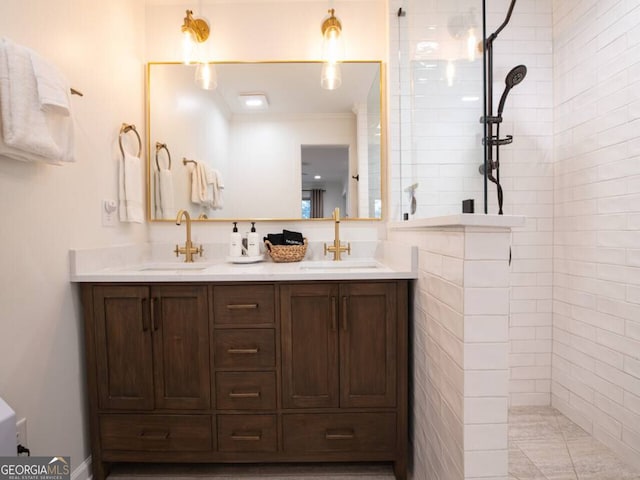 bathroom featuring vanity and tiled shower