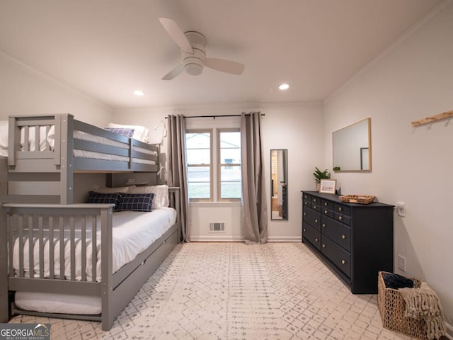 bedroom with ceiling fan and crown molding