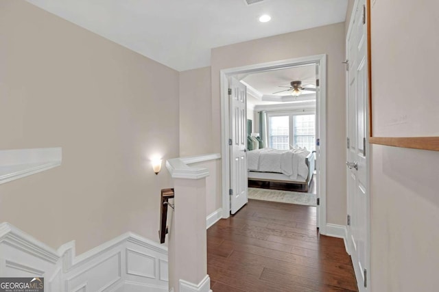 hallway with dark hardwood / wood-style flooring