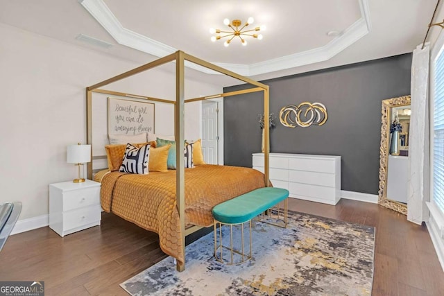 bedroom featuring multiple windows, dark hardwood / wood-style flooring, and a notable chandelier