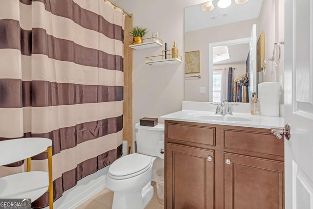 full bathroom with tile patterned floors, vanity, toilet, and shower / tub combo with curtain