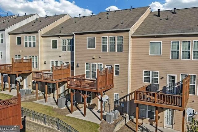 rear view of property with a patio and cooling unit