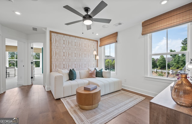 living room with plenty of natural light and wood-type flooring