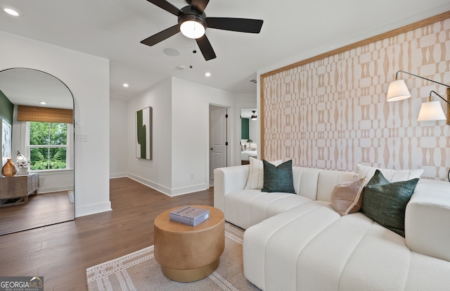 living room with ceiling fan and wood-type flooring