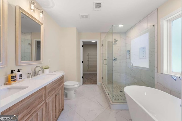 full bathroom with vanity, toilet, and shower with separate bathtub