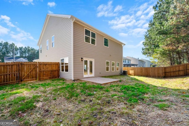 back of property featuring a yard and a patio